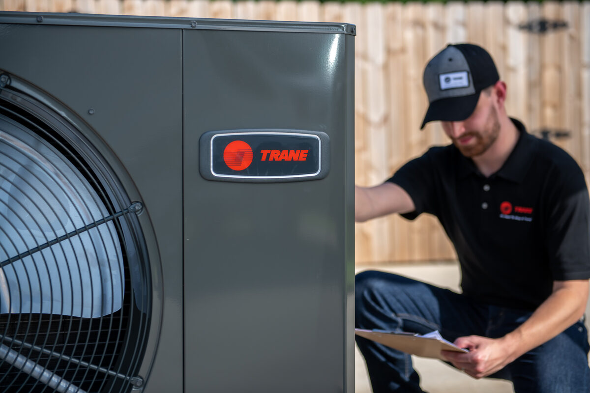 Technician working on HVAC system