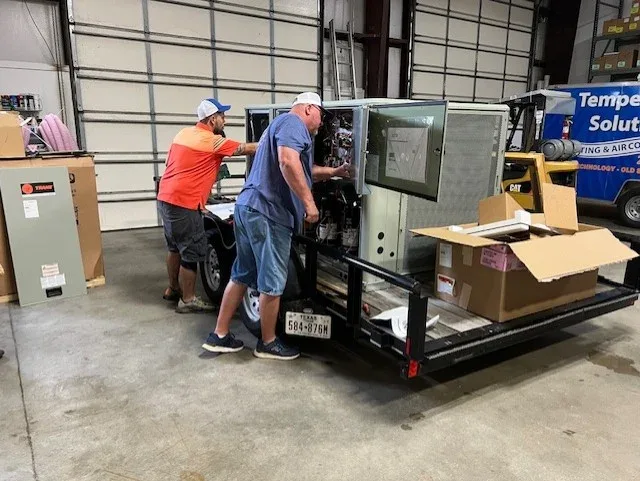 Todd and Josh working on HVAC equipment